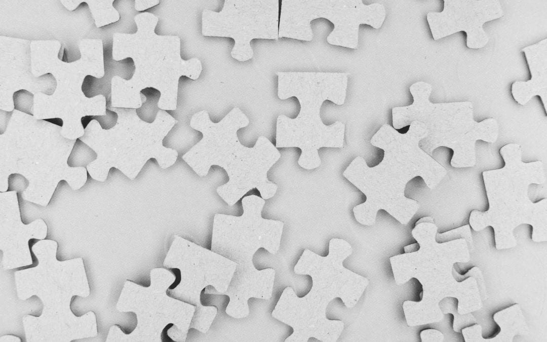 White puzzle pieces on a white background