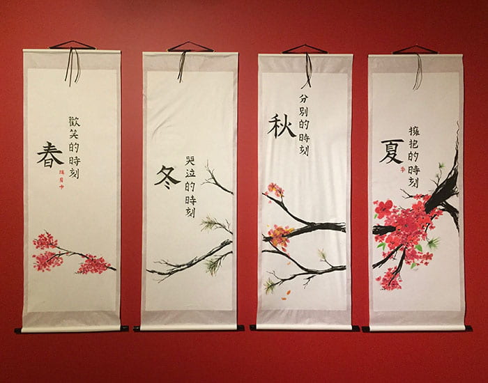 Artwork - a series of silk banners with a cherry blossom branch reflecting the changing of seasons