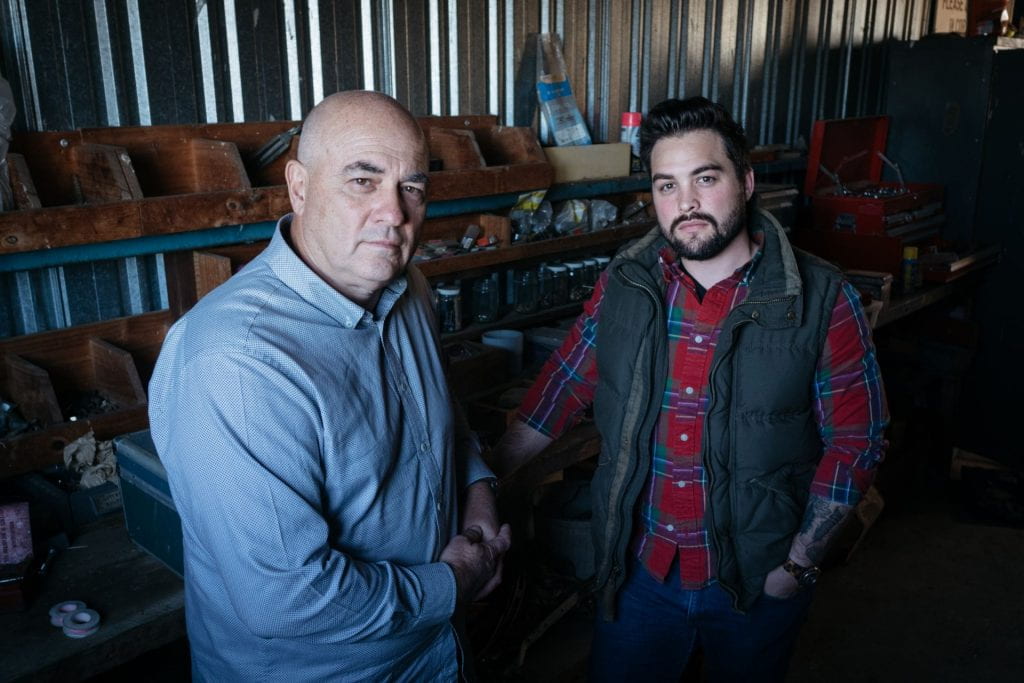 UNE Centre for Rural Criminology Directors A/Prof Glenn Porter and Dr Kyle Mulrooney in a farm shed