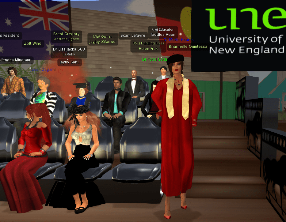 A computer graphic representation of UNE education PhD graduate Dr Merle Hearns walks towards the podium to accept her testamur and medal at her virtual UNE graduation, watched by her family, friends and supporters