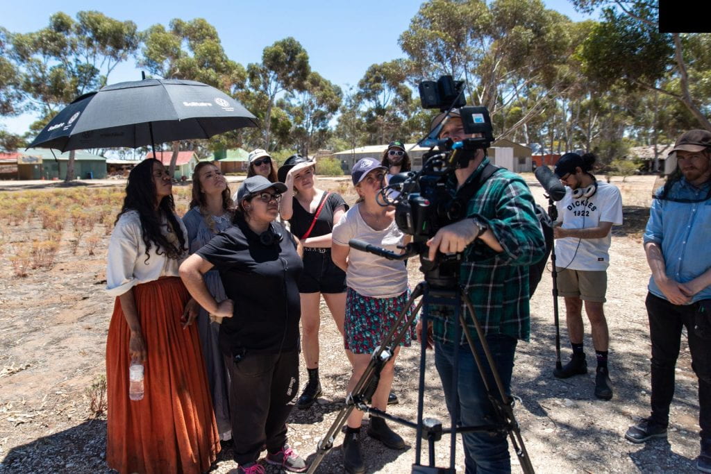 The film crew for UNE Mater of Arts student Kate Bonney's film Waiyirri, assemble in the arid Australian landscape.
