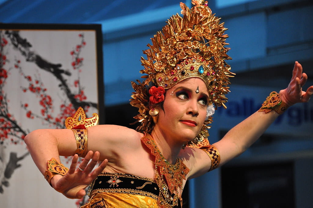 Dr Jane Ahlstrand in ornate traditional Indonesian costume performing Balinese dance