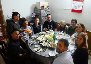 UNE students having lunch with host -Madame Ye at Shanghai Cao Yang Village