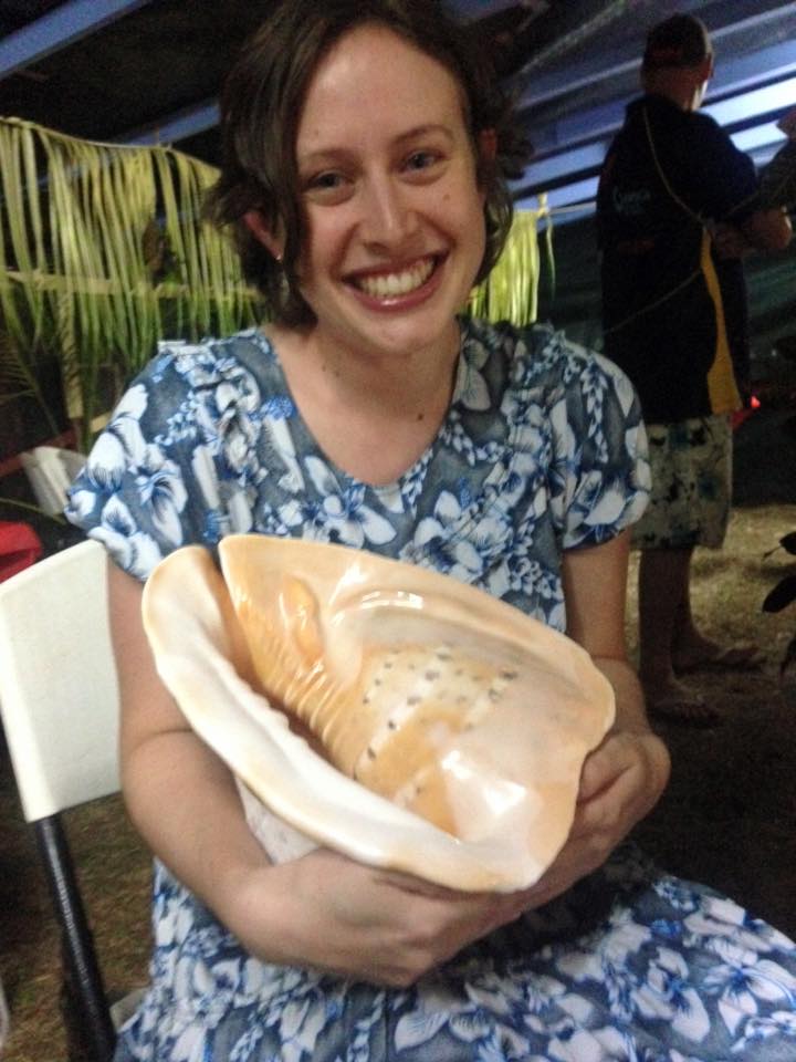 Julia holding a Helmet Shell that was a traditional gift from the Ugarem Le (the people of Ugar/Stephens Island).