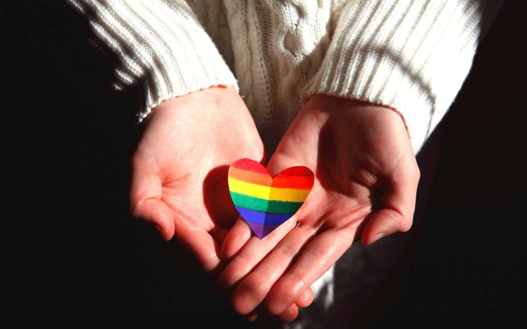 Rainbow Heart in palm of two hands