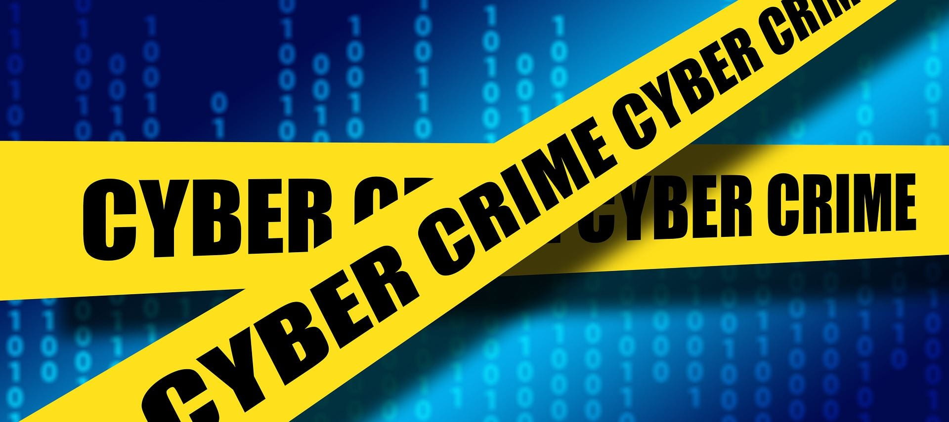 Yellow crime scene tape with "cyber crime" printer on the tape.